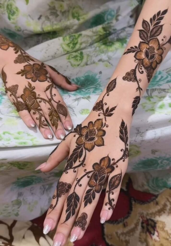 Intricate Arabic floral mehndi design with dark shading on the back of the hand and wrist. - How Many Types of Mehndi Design Are There