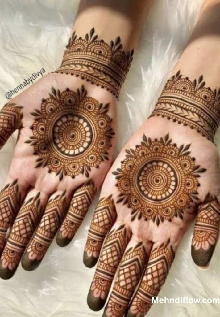 Palms featuring intricate central mandalas with bold, structured finger and wrist detailing.