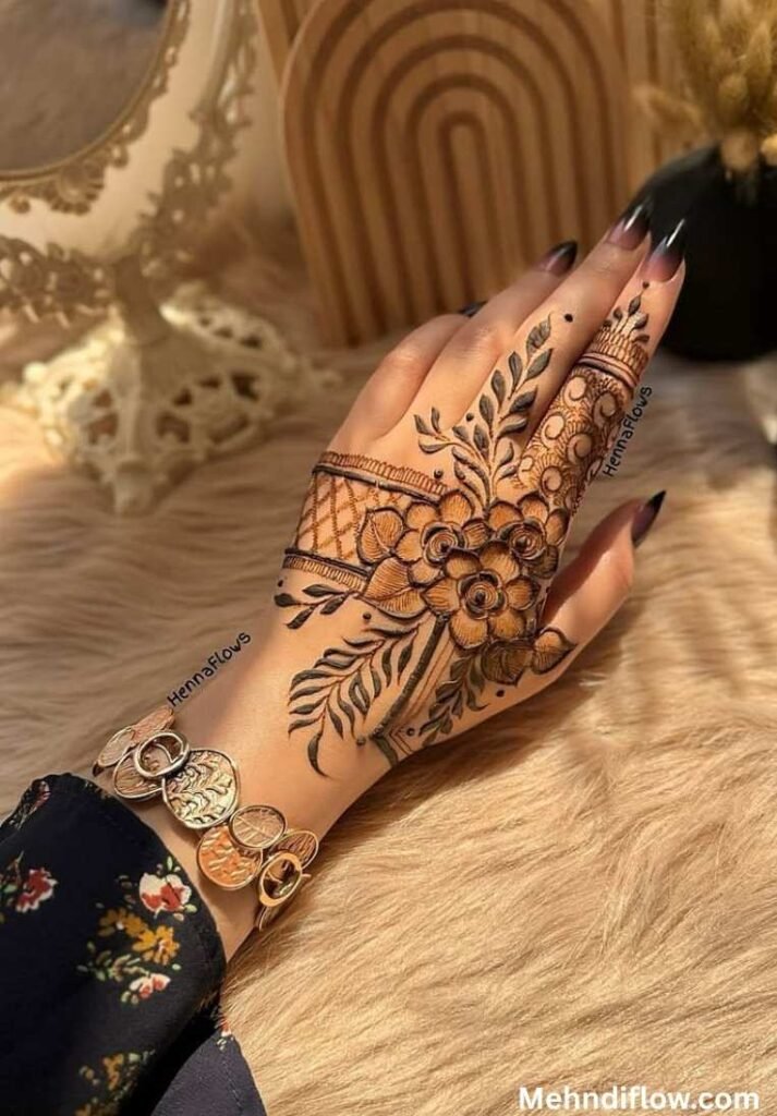 Intricate floral back hand mehndi design with leafy patterns and net detailing