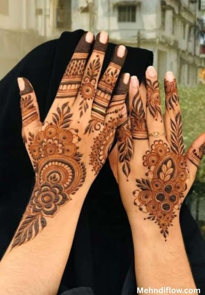 Intricate shaded inner palm mehndi design with heavy floral motifs and a detailed wrist cuff