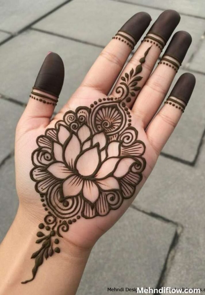 Dramatic 12-petal lotus mehndi design on the palm with intricate swirling mandala borders and fully capped fingertips.