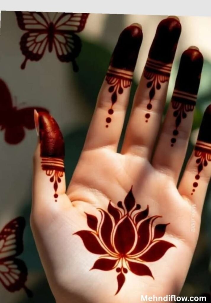 Reddish-brown 8-petal lotus henna design on the palm with elegant dotted line patterns on the fingers.