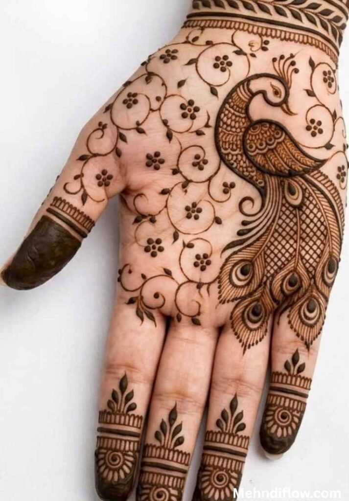 Intricate palm henna design featuring a detailed peacock silhouette paired with delicate floral vine fillings and neat finger caps.