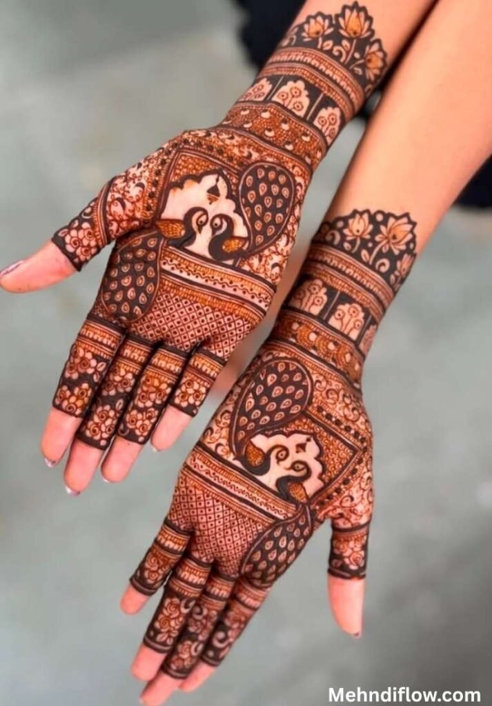 Symmetrical dual peacock henna design split across the back of both hands to form a mirrored layout when joined.