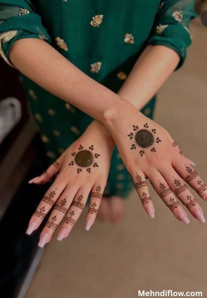 Minimalist Eid circle mehndi design across both hands featuring clean circular discs surrounded by small delicate leaf accents.