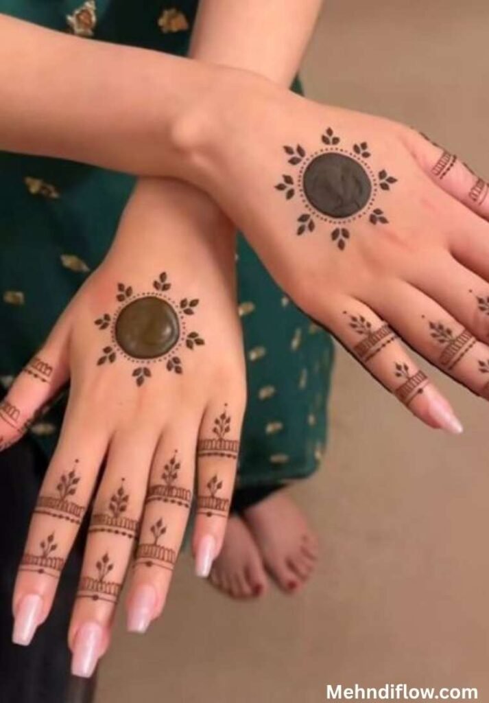 Simple Mandala mehndi design featuring a bold central circle with minimalist geometric dots and leaf patterns on the fingers.