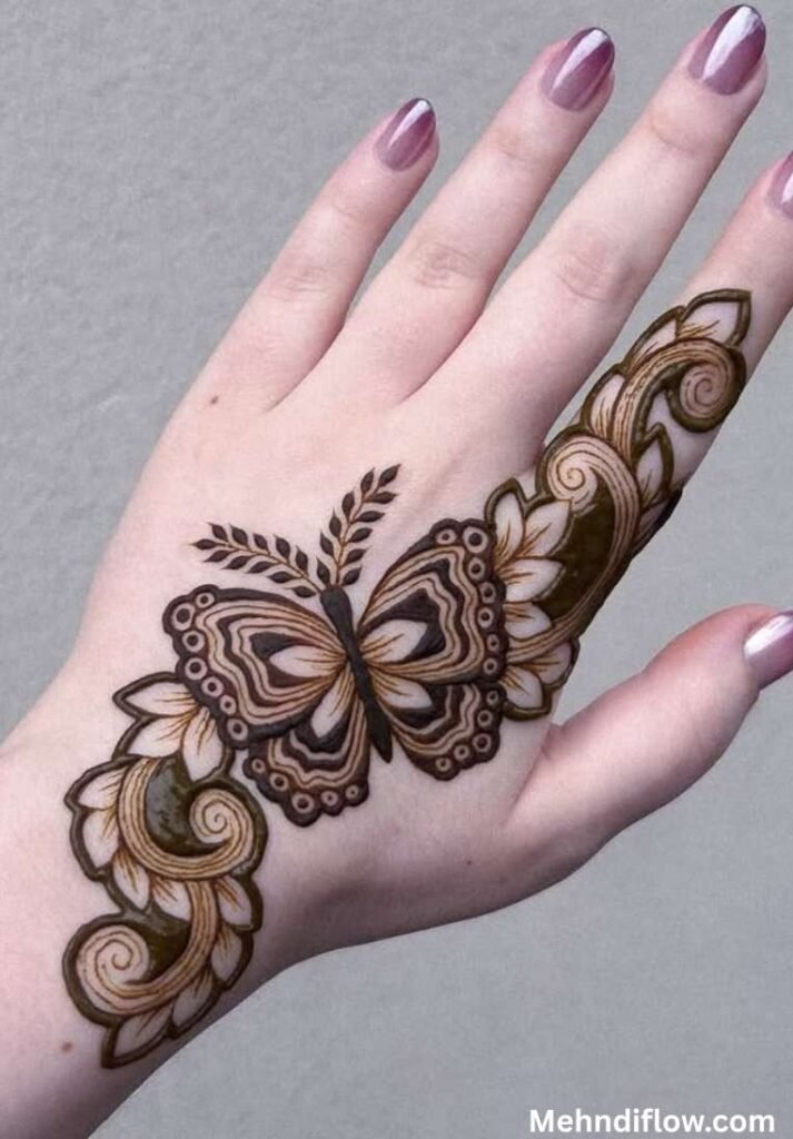Elegant back-hand henna design featuring a bold butterfly centered between flowing leafy vines.