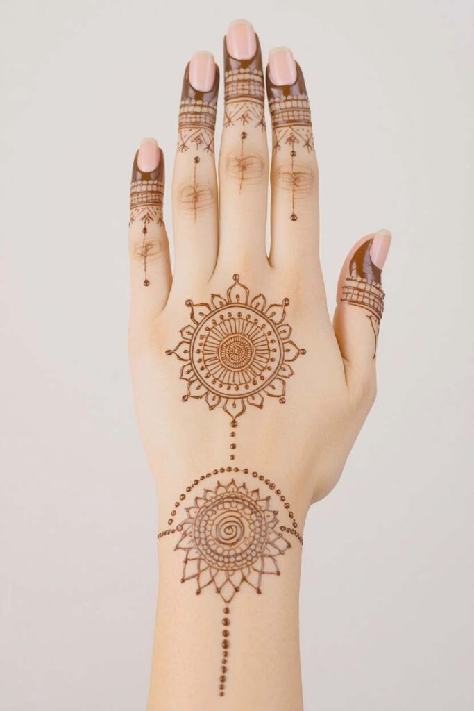 Mandala mehndi design surrounded by a delicate net pattern