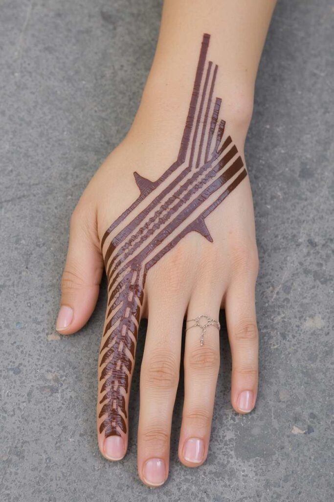  Modern boys back-hand mehndi design with bold lines and angular shapes.
